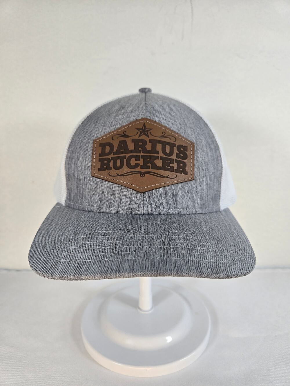 Darius Rucker Branded Snapback Trucker Hat With A Brown Leather Patch Logo.